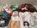 a lot of clothes that are sitting on a table