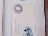 an open book on a table with a stamp on it