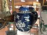 many vases on display in a glass case