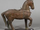 statue of a horse with a harness on it ' s back