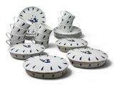 a lot of plates and cups on the table