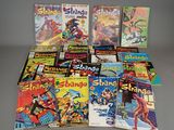 a bunch of comic books sitting on top of a table