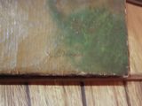 a close up of a book on a wooden table