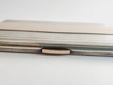 a stack of papers sitting on top of a white table