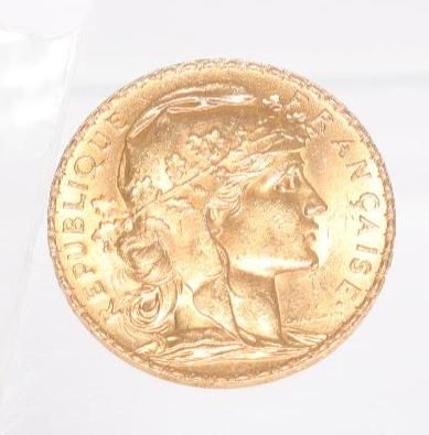 an image of a gold coin with a woman ' s head on it