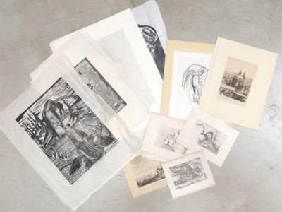 a lot of drawings on the floor of this room