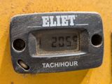 a close up of a digital clock on a yellow wall