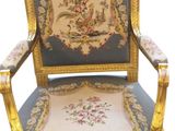 an image of a gold and blue chair with a floral design on it