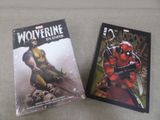 wolverine and deadpool comic books on a table