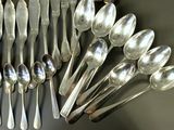 a lot of spoons and spoon spoons on the table