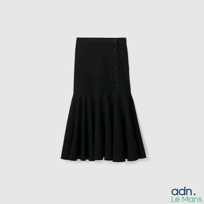 the skirt is black and has buttons on the front