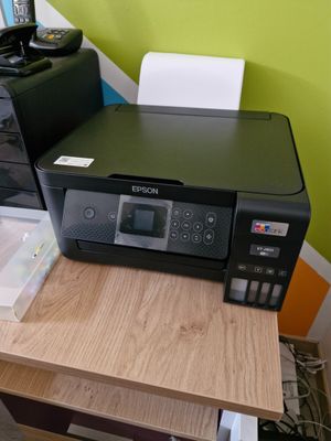 a printer that is sitting on top of a desk