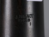 an old black and white photo of a bottle with a label on it