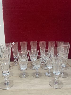 a lot of wine glasses sitting on a table