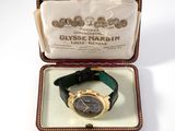 an image of a watch in a case on a white surface