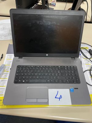 a laptop computer sitting on top of a desk