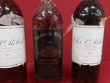 three bottles of wine that are sitting on a table