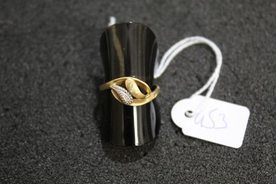 a ring that is sitting on a table next to a price tag