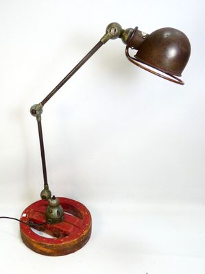 a lamp that is on top of a wooden stand