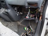 a picture of a car dashboard with wires and wires in it