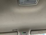 a picture of a car ' s dashboard with a clock on it