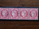 the stamp is pink and has four different images of women on it