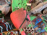 many skateboards that are stacked up together on a table