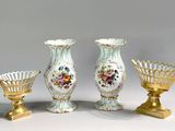 three vases sitting next to each other on a table