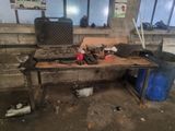 a workbench with tools on top of it in a building