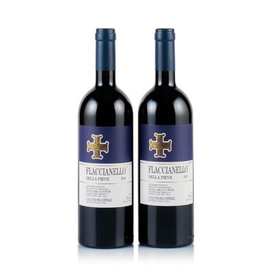 two bottles of red wine sitting next to each other on a white surface