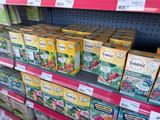 many boxes of tea on the shelf in the store