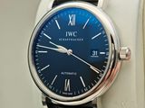 a close up of a wrist watch with a blue dial