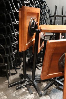 many chairs and a table in a room with a lot of them
