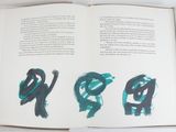 an open book with a picture of the letters p and p on it