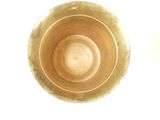 a close up view of a gold vase on a white background