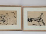 two framed drawings of a man and a woman on a beach