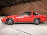 an image of a red car parked in a garage
