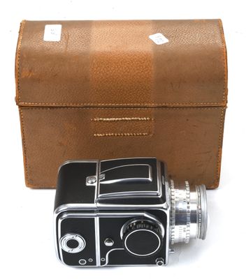 brown leather case for a camera and a brown leather case for an old camera