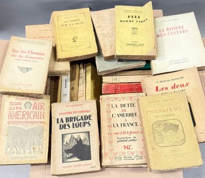 several old books are stacked on top of each other on a table