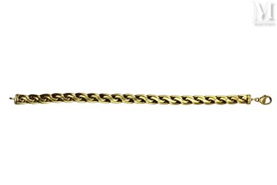 a gold chain bracelet on a white background
