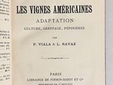 an open book on a table with a black and white image of the title