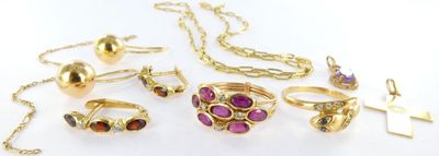 several different types of jewelry are displayed on a white surface