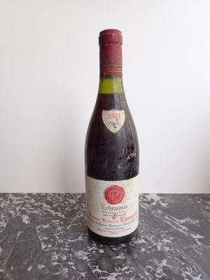 a bottle of wine that is sitting on a table
