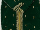 an image of a green and gold dress with a bird on it