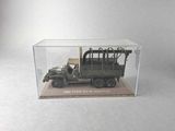 a toy army truck with a wooden crate in the back