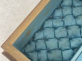 a box that has a blue cloth inside of it