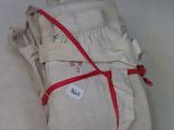 a stack of white cloth wrapped in red ribbon