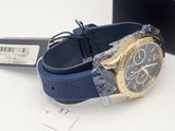 a watch that is sitting on a table next to a box