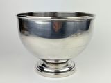 a silver bowl on a silver pedestal on a white background