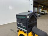 a yellow motorcycle with a black box on the back of it